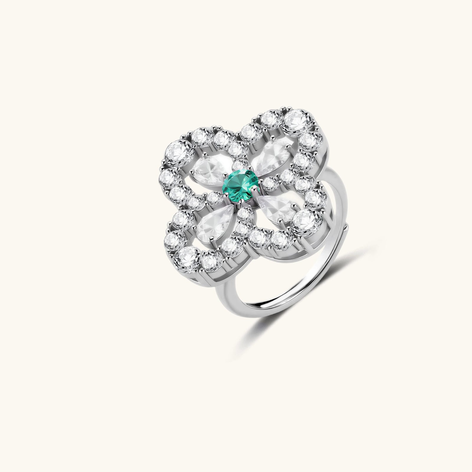 Sterling silver adjustable ring featuring four-leaf clover design with green center moissanite and clear accent stones