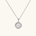 Cushion-shaped double halo pendant with 10mm freshwater pearl center on rhodium-plated sterling silver chain