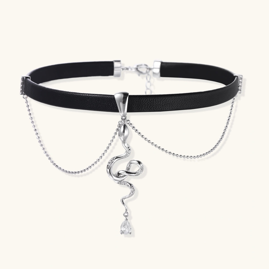 Black leather choker with white gold-plated serpent pendant adorned with zirconia crystals and teardrop charm