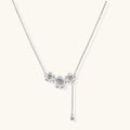 White gold plated Y-shaped necklace with three dimensional flower charms and adjustable drop pendant
